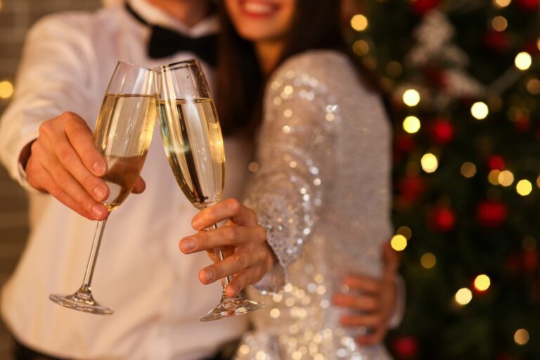 Young,Couple,With,Champagne,Celebrating,New,Year,At,Party,,Closeup